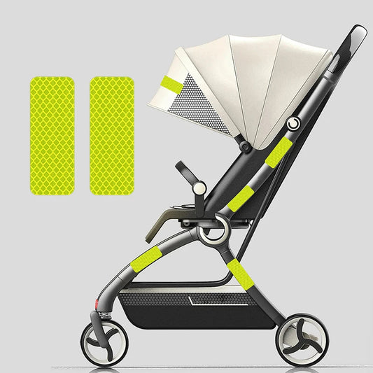 Stroller Reflective Patch - Stroller with 4 reflective green patches attached to it side. There is also 2 green amplified size patches on the left side so you can see it's patterns.